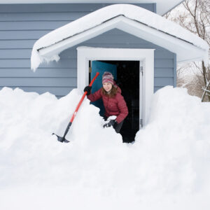 Mom tries to get to the sidewalk after a blizzard